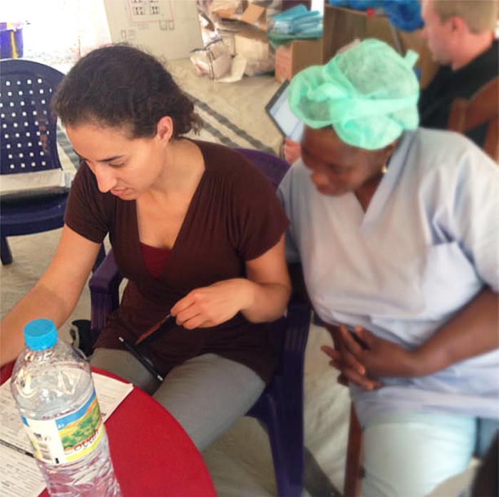 Public health professionals discussing Ebola contact tracing